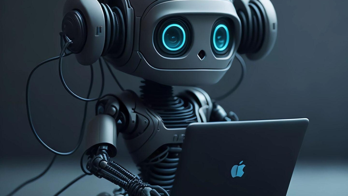 Ein Roboter mit großen Kopfhörern sitzt vor einem Laptop und tippt auf der Tastatur.